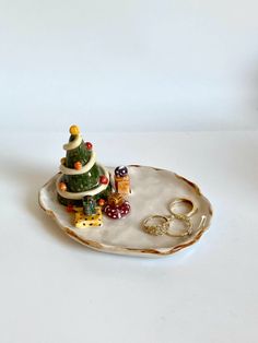 a small christmas tree sitting on top of a plate