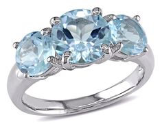 4.35 Carat (ctw) Blue Topaz Three Stone Ring in Sterling SilverThis beautiful ring features three round-cut sky blue topaz stones set in sleek sterling silver.  A 2.35 carat (ctw) brilliant round center stone is supported on 2 sides by a 6x6mm 2.00 carats (ctw) of round blue topaz gems making this stylish and affordable three stone ring featuring the birthstone of December. This charming ring is enhanced with a high polish finish.Beautifully Crafted in 0.925 Sterling Silver with a Polished Finis Topaz Rings, Cut Rings, Rings Blue, Topaz Jewelry, 3 Stone Rings, Three Stone Ring, Blue Topaz Stone, Jewelry Blue, Sky Blue Topaz