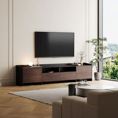 a large flat screen tv mounted to the side of a wall in a living room