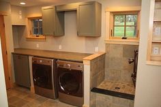 an image of a laundry room with washer and dryer combos in it