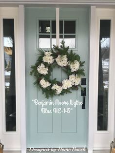 a blue front door with white flowers and greenery on the side, and an advertise that reads gengarn moore white blue ale - 473