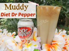 there is a drink and some flowers on the table with text overlay that reads muddy diet dr pepper