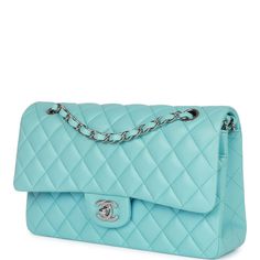 This Medium Classic Double Flap bag is in blue lambskin leather with silver tone hardware and features a front flap with signature CC turnlock closure, half moon back pocket, and adjustable interwoven silver tone chain link and blue leather shoulder strap. The interior is lined in blue leather with the "love letter" zipper compartment under the first flap, an "outer" slit pocket is under the second flap, and an interior compartment with two open pockets separated by a "lipstick" compartment. Col Chanel Box, Shopping Chanel, Leather Thread, Prada Handbags, Neon Blue, Love Letter, Chanel Handbags, Half Moon, Flap Bag