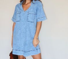 Denim collared pocket front v-neck mini dress. 94% cotton 6% Polyester Darby sized down to a small. Darby is 5’8.5 size 6/8. V-neck Denim Dress With Pockets, V-neck Denim Dress For Work, Trendy V-neck Denim Dress For Day Out, Light Wash Cotton V-neck Denim Dress, Casual Cotton Mini Dress With Collar, Denim V-neck Dress With Pockets, Summer Washed Collared Dress, Summer Collared Washed Dresses, Casual V-neck Mini Dress With Pockets