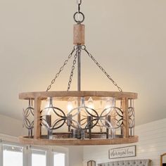 a chandelier hanging from the ceiling in a room