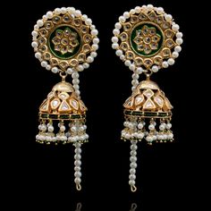 Blend of craftsmanship and intricate layout, making this set a classic must have.This look includes a pair of beautiful jhumkey earrings with pearl ear chain and a teekah. Approximate earrings length is 3.6".Gold-plated on high-quality brass as base metal. In-stock & ready-to-ship. *Please Note: We use faux stones and beads in all of our jewelry. Ceremonial Chandelier Earrings With Latkans For Festivals, Bollywood Style Tilla Danglers For Ceremonial Occasions, Bollywood Tilla Danglers For Ceremonial Occasions, Ceremonial Kundan Tilla Earrings, Elegant Kundan Earrings For Rituals, Elegant Brass Tilla Danglers, Elegant Brass Danglers With Tilla, Kundan Earrings With Latkans For Rituals, Ceremonial Chandbali Brass Jhumkas