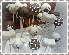 a bunch of cake pops that have dogs on them