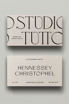 two business cards with black and white lettering