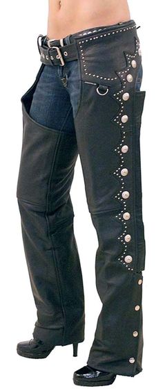 Western chaps with conchos, mini studs and scallop trim made of black Ultra Premium leather. Decorated down each leg and around the back. A Jamin Leather® exclusive original design! This unisex cowgirl chap has a nylon mesh lining, an adjustable belt, back lacing and made of Ultra Premium top grain cowhide. You can trim the length on these western leather chaps, if needed, with household shears. Sizes: S, M, L, XL, 2X, 3X, 4X, 5X. +$10 for 2X-3X, +$20 4X-5X. [6#] soft nylon mesh lining snap cuff Cowgirl Chaps, Cowboy Chaps, Western Chaps, Harley Davidson Merchandise, Motorcycle Chaps, Leather Chaps, Biker Outfit, Biker Chic, Biker T Shirts