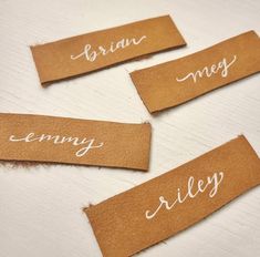 three pieces of brown paper with white writing on them that say brun, lemony, and riley