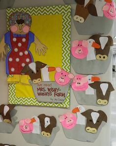 a bulletin board with farm animals and pigs on it