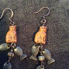 Glass Cat Bead Has Three Bronze Fish Hanging From Them. Bronze Fish Hook Ear Wires. Light Weight. Earrings Hang Two Inches. Teacher Fits, Glass Cat, Cat Bead, Thread Jewellery, Jewellery Sets, Cat Earrings, Light Weight Earrings, Fish Hook, Bronze Color