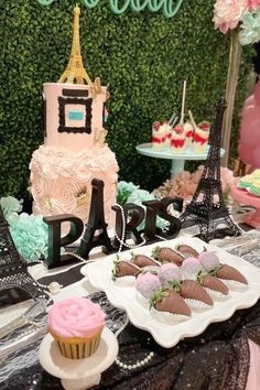 the dessert table is set up for a paris themed party