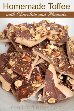 homemade toffee with chocolate and almonds on a white plate, ready to eat