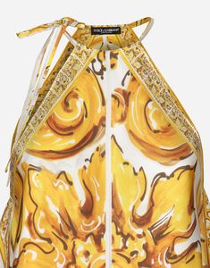 Silk twill halterneck top with majolica print: White and Yellow Halterneck with ties Sleeveless Lined in twill Tie details on sides The model is 175 cm tall and wears a size IT 40 Made in Italy Luxury Silk Tops For Summer, Summer Silk Tie Back Tops, Designer Printed Summer Tops, Elegant Baroque Print Tops For Summer, Elegant Baroque Print Summer Tops, Designer Printed Tops For Summer, Designer Baroque Print Tops For Summer, Luxury Floral Print Summer Tops, Designer Yellow Summer Tops