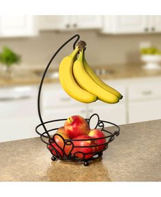 a fruit basket with bananas and apples in it