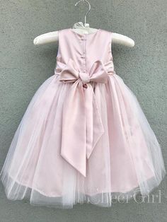 Simple cute flower girl dress with sash. It can be made in other colors,please contact us 1.Silhouette:A Line 2.Fabric:Tulle&Satin 3.Embellishment:Sash 4.Neckline:Round Neck 5.Sleeve:Sleeveless 6.Waistline:Natural 7.Hem-length:Floor Length 8.Back Details:Zipper 9.Fully Lined:Yes 10.Built-In Bra:None 11.Boning:None 12.Picture Color:As Picture Dresses With Bow, Cheap Flower Girl Dresses, Pink Flower Girl Dresses, Cheap Flowers, Occasion Dresses Wedding, Cute Flower, Nude Pink, Flower Girl Dress