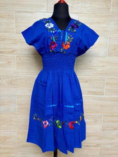 This dress is one size fits all size S/M Beautiful and fresh handmade Mexican dress, with a V-neckline. This dress has a spring at the waist to highlight the figure and details with ribbons and lace that make it unique. Each dress has unique embroidery so colors may vary. We ship anywhere in the word, from Tepic, Nayarit,  mx. Made by artisans from Oaxaca, Mx We recommend washing by hand with cold water, tender in the shade, to better preserve the original color Aztec Clothing, Blanket Dress, Hand Embroidered Dress, Mexican Dress, Unique Embroidery, Mexican Dresses, Ethnic Dress, Embroidered Dress, Dress Clothes For Women