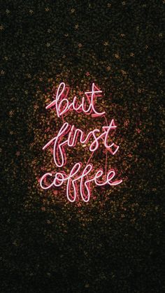 a neon sign that says, but first coffee on the ground in front of a dark background