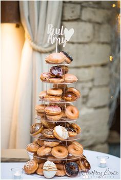 a stack of donuts sitting on top of a table