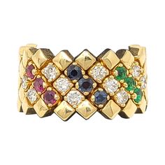 Beautiful multi-row link ring with a pretty pop of color and sparkle! This unique ring features 5 rows of polished 14 karat yellow gold diamond shaped links set in a flexible design. The front half of the ring is embellished with diagonal rows of sparkling prong set gemstones, adding some color and detail to the piece. There are 3 red rubies, 3 green emeralds, 3 blue sapphires and 10 natural diamonds. The diamonds are a stunning F-G in color and VS in clarity, and really pop against the warmth o Rose Gold Band Ring, Sapphire Eternity Band, Fantasy Ring, Link Ring, Gold Diamond Band, Linking Rings, Rose Gold Band, Gold Band Ring, Unique Ring