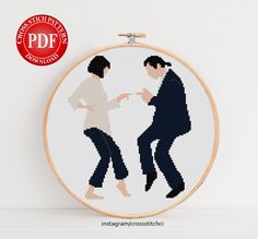 two people are dancing together in cross stitch