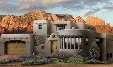 an artist's rendering of a house in front of a mountain range at sunset