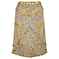 Cher Michel Klein- Brownish-grey tulle skirt embroidered with silvery and golden pearls and sequins. Size 36FR. Additional information: Condition: Very good condition Dimensions: Waist: 37 cm - Length: 57 cm Seller Reference: FJ216 Embellished Evening Skirt, Embellished Gold Skirt For Party, Gold Embellished Skirt For Party, Elegant Embellished Gold Skirt, Elegant Gold Embellished Skirt, Glamorous Embellished Gold Skirt, Elegant Gold Skirt For Festive Occasions, Glamorous Gold Embellished Skirt, Festive Gold Skirt For Party