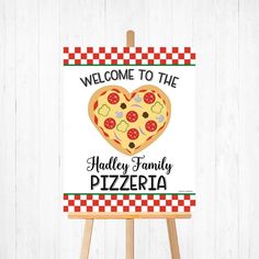 a sign with a heart shaped pizza on it that says welcome to the halley family