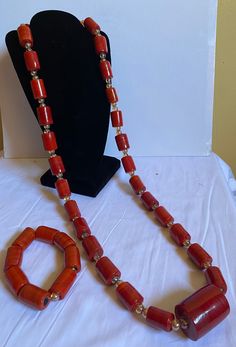 African Nigeria Coral Glass Long beads for men, unisex coral beads, Groom beads for wedding. Yoruba/Igbo/Igbo/Edo/Benin wedding coral glass bead. Men's jewelry. African necklace for men. Coral beads. For bride and groom.  2 piece includes 1 necklace and 1 bangle  Materials: Coral glass beads Mostly used - Traditional Wedding/marriage, Engagement, Baby Dedication, formal events. Contact for personalized orders  Kindly allow a difference of the picture/pattern of your item(s) between the real-life image and the photographic image on the website. No refund/no return /no exchange Benin Wedding, Glass For Men, Beads For Men, Wedding Coral, African Suit, Baby Dedication, African Necklace, African Jewelry, Coral Beads