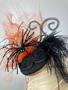 This fancy Halloween fascinator hat is a great little headpiece for that occasion that calls for a bit of style. The base is a covered in black silk with a pumpkin orange band. It's topped with a beaded spider and wire spider web, black accents and orange distressed crin. It sits at a dramatic angle on the head for maximum style. The small scale of this fascinator makes it easy to wear for events or even to dinner. Completely hand sewn for a uniquely one-of-a-kind hat. Mounted on a narrow headband to help keep it in place. Step out in style! In stock and ready to ship. +++++++++++++++++++++++++++++FIT AND SIZE:One size - mounted on a narrow headband. ++++++++++++++++++++++++++++++SHIPPING:Free shipping in the contiguous US via USPS. +++++++++++++++++++++++++++++++ CUSTOM ORDERS:I am happy Spooky Black Costume Hats And Headpieces For Party, Black Hats And Headpieces For Costume Party, Kentucky Derby, Adjustable Halloween Costume Hats And Headpieces For Evening, Elegant Halloween Costume Fascinator, Adjustable Hat For Halloween Evening, Black Mini Hats For Halloween Evening, Adjustable Halloween Evening Headpieces, Adjustable Halloween Evening Hat, Halloween Fascinator Headband For Costume Party