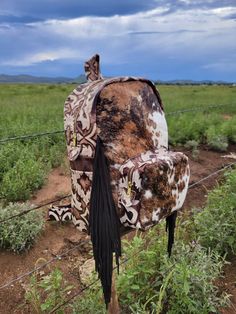 This backpack is approximately 17 tall by 14 wide with a solid brown leather back and laredo accent Leather. 4 interior pockets 2 exterior pockets Leather fringe  Adjustable straps *Please take into consideration our bags are created utilizing the best quality hides around. However from time to time the hides can have natural wear marks from fence posts, fences etc Western Bookbags, Western Diaper Bag, Western Backpack, Cowhide Backpack, Leather Diaper Bag, Western Stuff, Aqua Nails