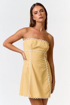 Strapless Scalloped Trimmed Detailing Mini Length Smocked Detailing A-Line Mini Dress Fabric: 30% Linen + 30% Cotton + 20% Polyester + 20% Rayon Model is Wearing a Size Small. Height is 5'8", Bust is 32A”, Waist 24”, and Hips 34” Cool Summer Dress Outfits, 60s Fashion Inspiration, Scallop Trim Dress, Yellow Summer Mini Dress, Feminine Yellow Mini Dress, Pale Yellow Mini Dress, Yellow Mini Floral Summer Dress, Spring Yellow A-line Mini Dress, Yellow A-line Mini Dress With Ruffles