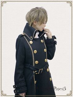 a person in a black coat with gold buttons