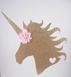 there is a cake topper with a unicorn on it