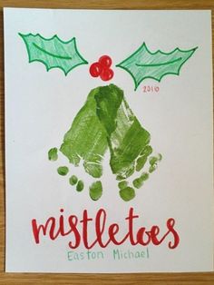 handprinted christmas card with holly leaves and mistletes