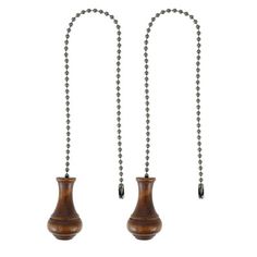 two wooden vases with chains attached to them on a white background, one is empty