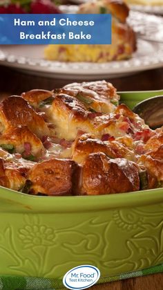 ham and cheese breakfast bake in a green casserole dish