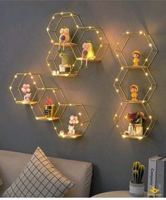 three hexagonal shelvings with lights on them are shown against the wall