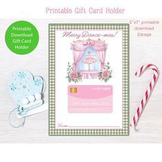 printable christmas gift card holder with candy cane and candies on the table next to it