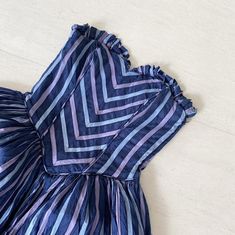 "This is a great piece to wear on weekends. A special made to order piece in the 80s by Elite Occasions. Dark purplish pink and blue on navy makes for a lovely color palette. I love the little pleating on the bustline - gives it an edge and a perfect contrast to those stripes. The drop waist lends a nice touch for a fitted and then flare look. So good for prancing around the garden! Side zip. Condition: Excellent Label: Elite Occasions Bust 30/31\" Waist 28\" Length 44\" (bust to hem) This item Blue Summer Dress With Accordion Pleats, Blue Accordion Pleated Dress For Summer, Blue Summer Dresses With Accordion Pleats, Grecian Goddess, Peacock Dress, 60s Dress, Star Dress, 50s Dresses, Drop Waist