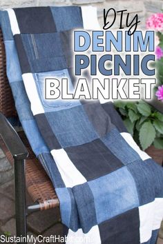 a blue and white blanket sitting on top of a chair next to a potted plant