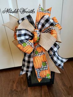 a large bow with pumpkins on it