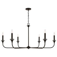 a black chandelier with six candles hanging from it