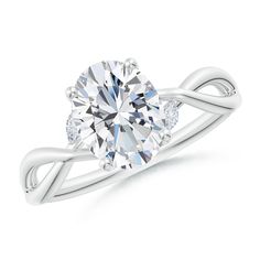 a white gold ring with an oval cut diamond in the center and two diamonds on each side