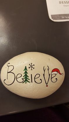 a rock with the word believe painted on it