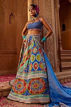 Royal blue and multi color attached cancan lehenga with all over floral jaal print, accentuated with heavy tassel strings with gota embroidery, hand adda work, beads and sequins embellishments. Paired with a padded blouse with floral embroidery and quatrefoil print. Comes along with a dupatta with an embroidered border.
Components: 3
Pattern: Print, Embroidery
Type Of Work: Floral Jaal, Sequins, Beads, Gota
Neckline: Scoop Neck
Sleeve Type: Sleeveless
Fabric: Blouse and Lehenga: Raw Silk, Dupatt Blue Bohemian Lehenga With Traditional Drape, Blue Bohemian Choli For Designer Wear, Blue Bohemian Sharara For Reception, Bohemian Blue Floor-length Lehenga, Blue Bohemian Floor-length Lehenga, Bohemian Style Blue Floor-length Choli, Bohemian Blue Floor-length Choli, Blue Bohemian Lehenga With Dupatta, Blue Bohemian Choli With Dupatta