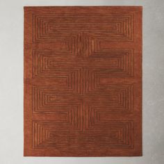 a brown rug with squares and lines on it