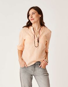 Simple sophistication make this lightweight summer top a weekend bag must. Chest pockets and three button open V-neck dial in the vibe in stride. Summer V-neck Top With Pockets, Summer Pink Blouse With Pockets, Casual Orange Top With Pockets, Casual Peach Blouse For Spring, Versatile Everyday Tops With Pockets, Versatile Tops With Pockets, Casual Peach Blouse For Day Out, Versatile Tops With Pockets For Everyday, Casual Tops With Relaxed Fit For Everyday