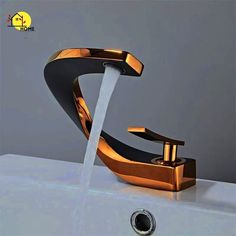 a faucet with water running out of it's spout and the word home above it